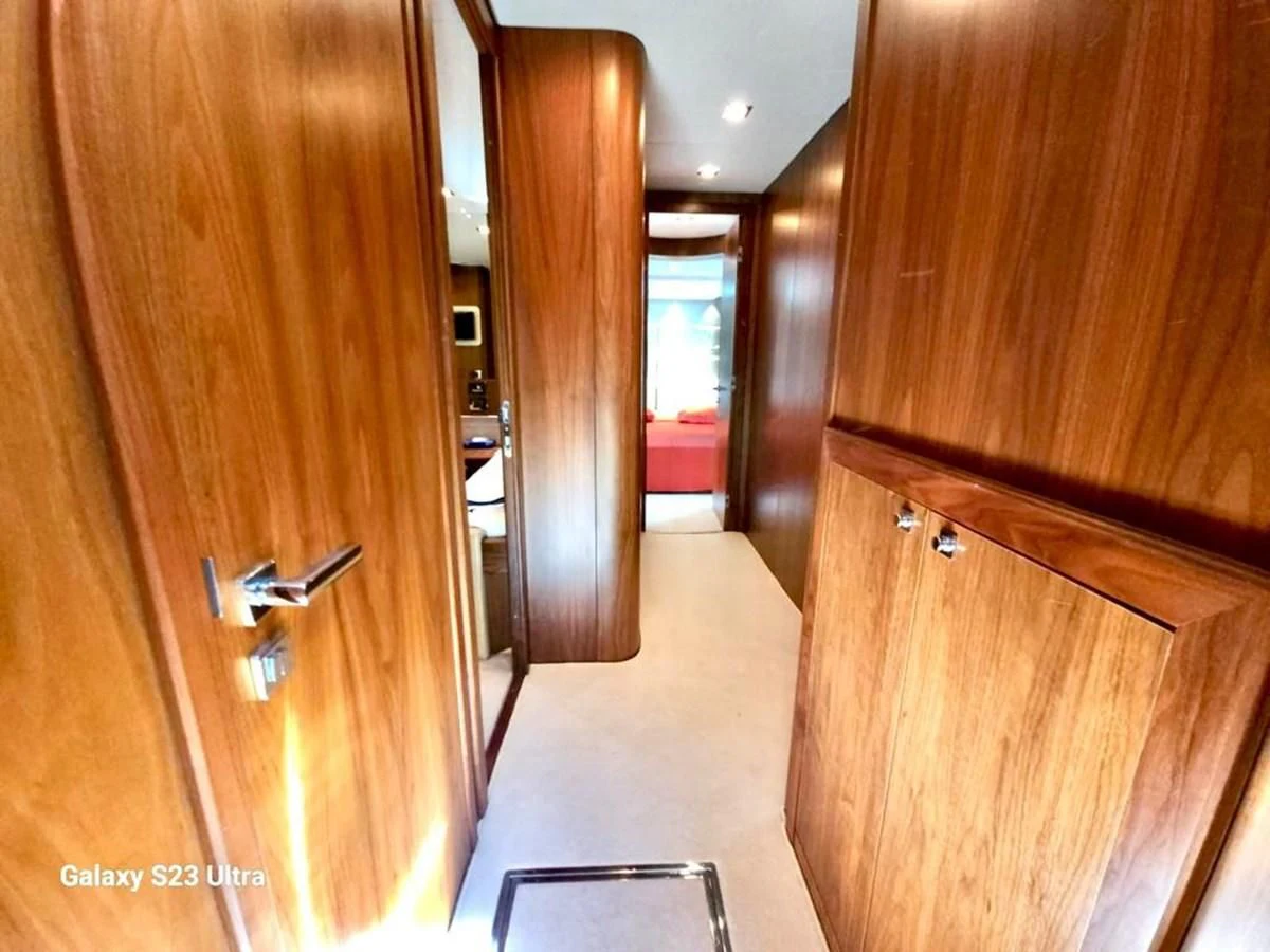 a hallway with wooden cabinets aboard FAMILY SPIRIT Yacht for Sale