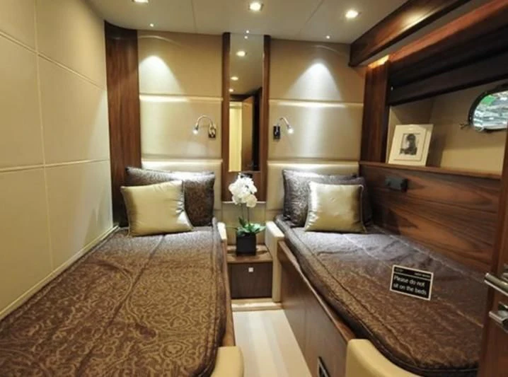 a hotel room with a bed aboard FAMILY SPIRIT Yacht for Sale