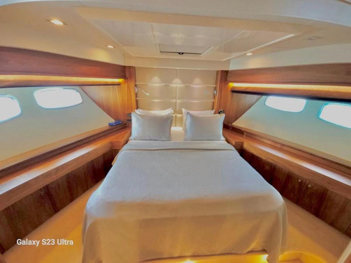 a bed with a pillow on it aboard FAMILY SPIRIT Yacht for Sale