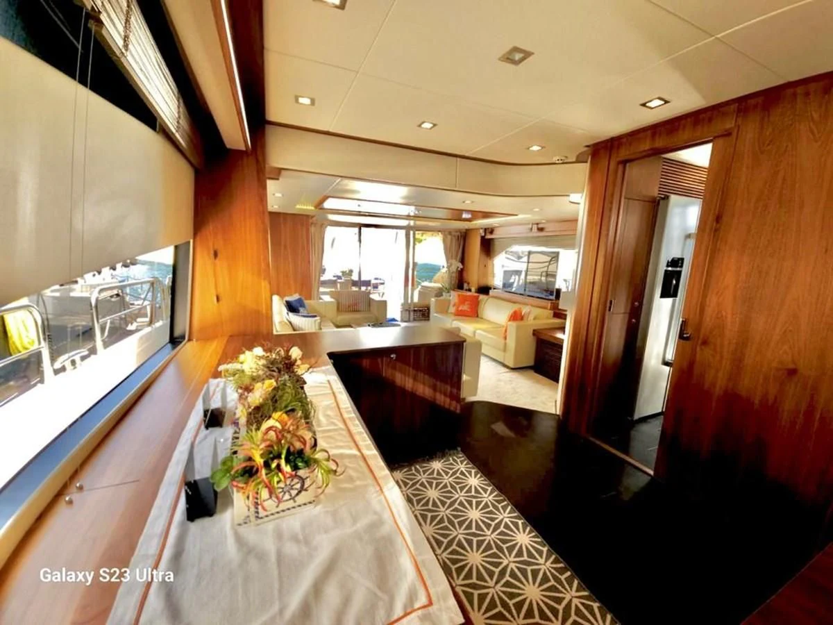 a room with a table and chairs aboard FAMILY SPIRIT Yacht for Sale