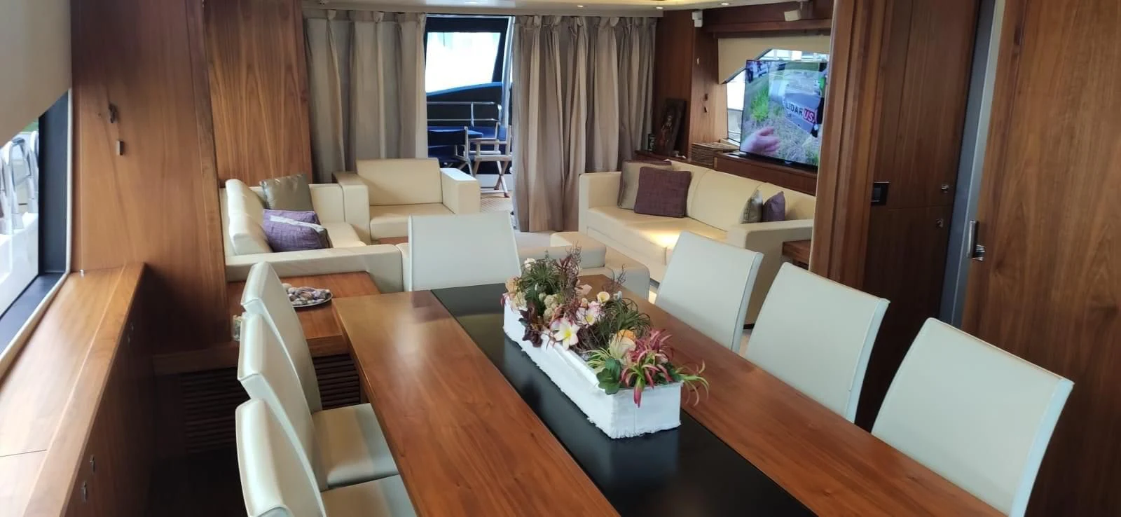 a room with a table and chairs aboard FAMILY SPIRIT Yacht for Sale