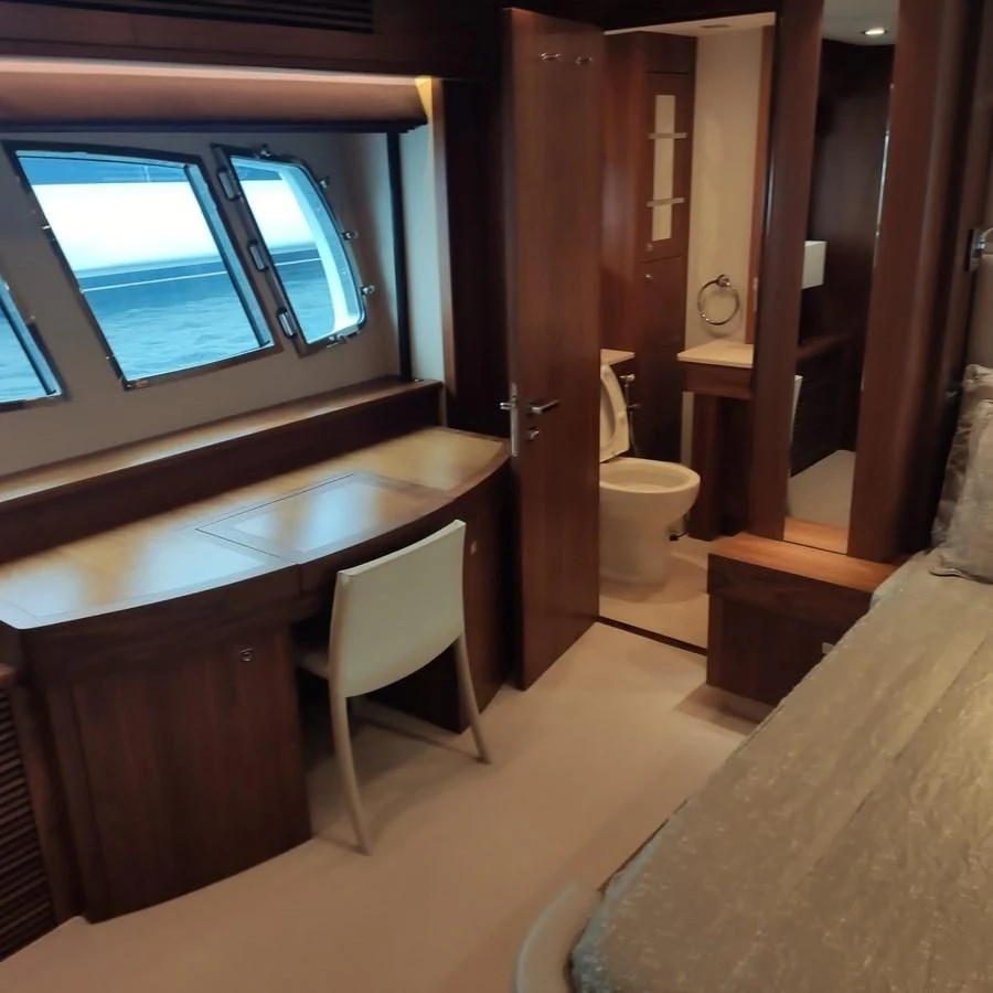 a bathroom with a tub and toilet aboard FAMILY SPIRIT Yacht for Sale