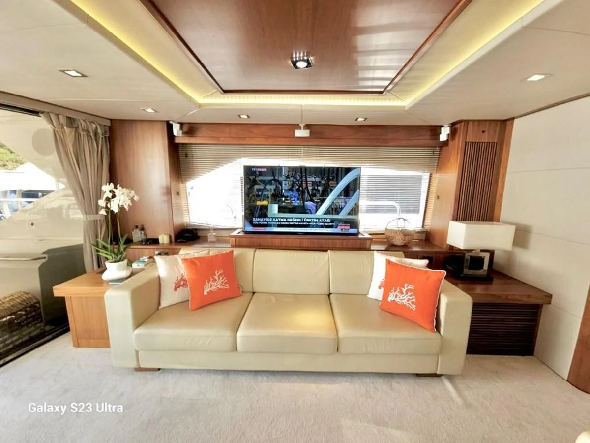 a living room with a large window aboard FAMILY SPIRIT Yacht for Sale