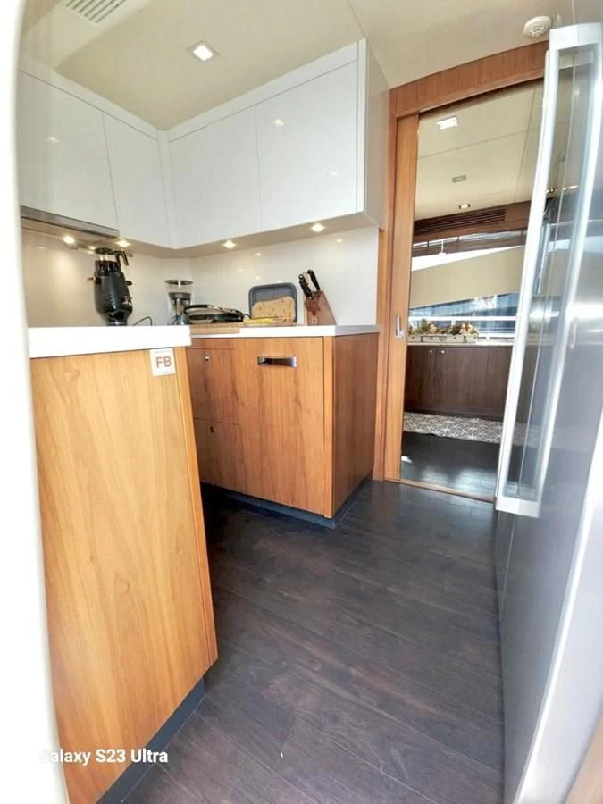 a kitchen with a glass door aboard FAMILY SPIRIT Yacht for Sale