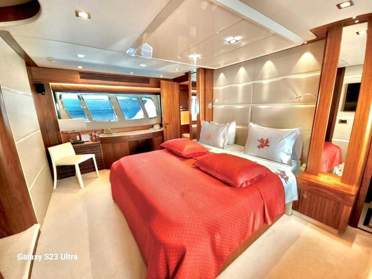 a room with a bed and a window aboard FAMILY SPIRIT Yacht for Sale