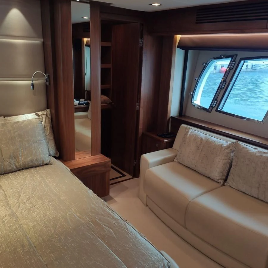 a room with a bed and a couch aboard FAMILY SPIRIT Yacht for Sale