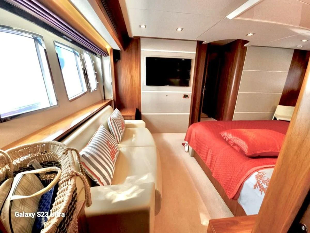 a room with a couch and a television aboard FAMILY SPIRIT Yacht for Sale