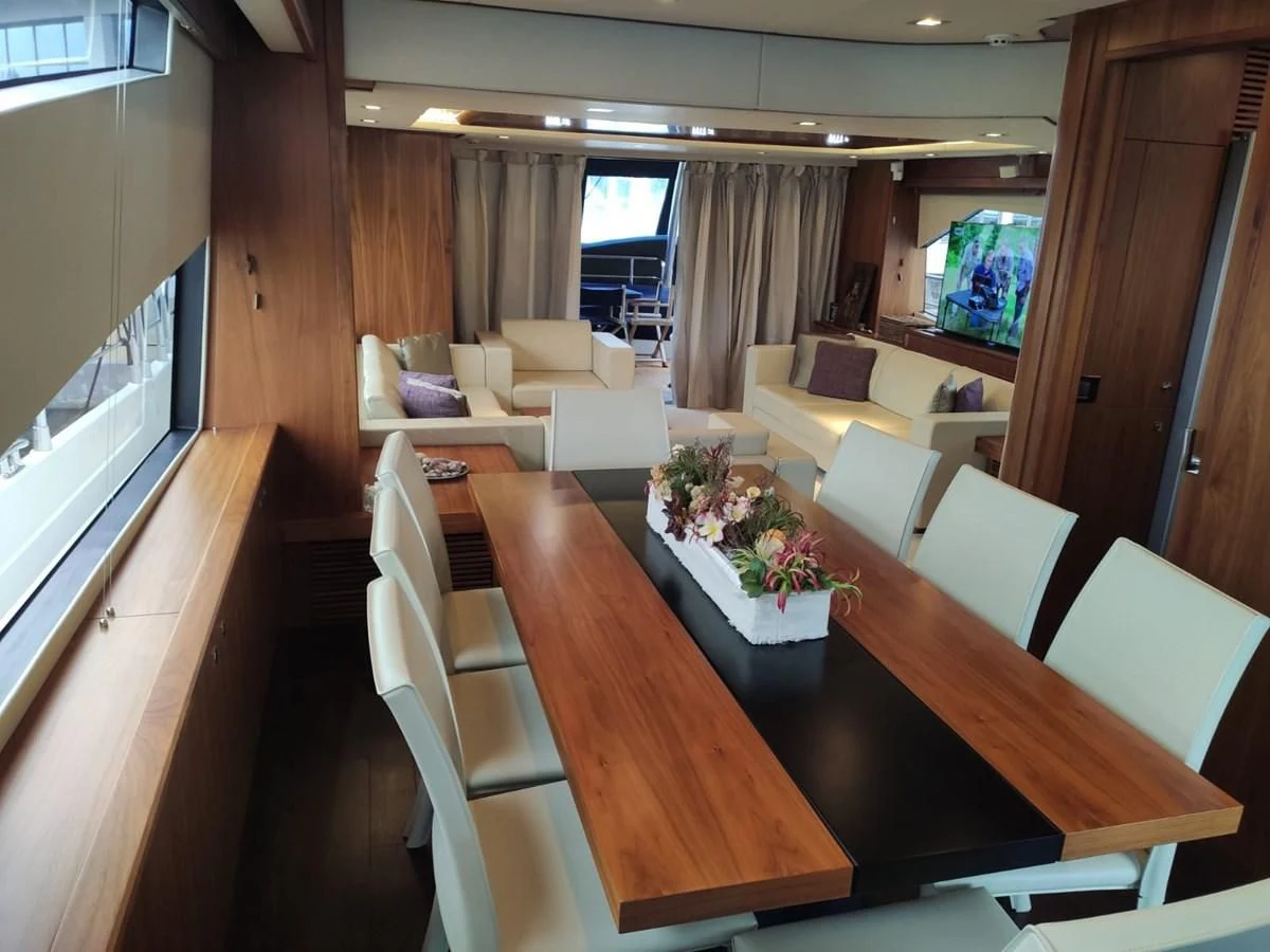a room with a table and chairs aboard FAMILY SPIRIT Yacht for Sale