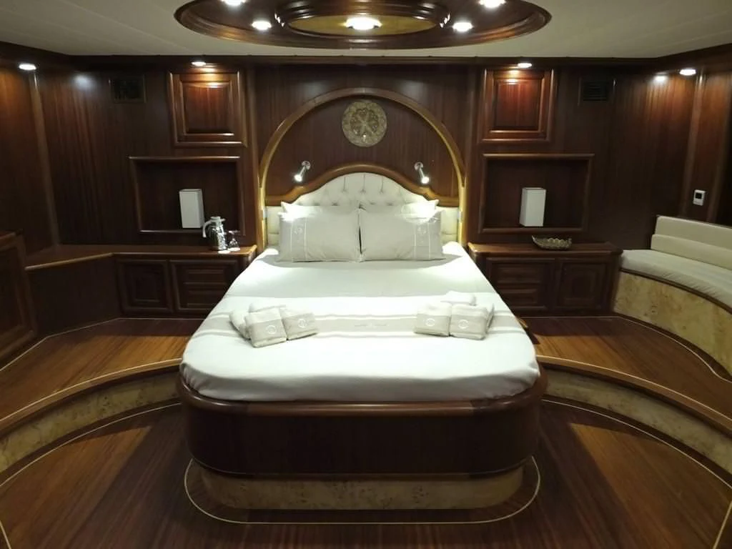 a large bed in a room aboard KAPTAN MEHMET BUGRA Yacht for Sale