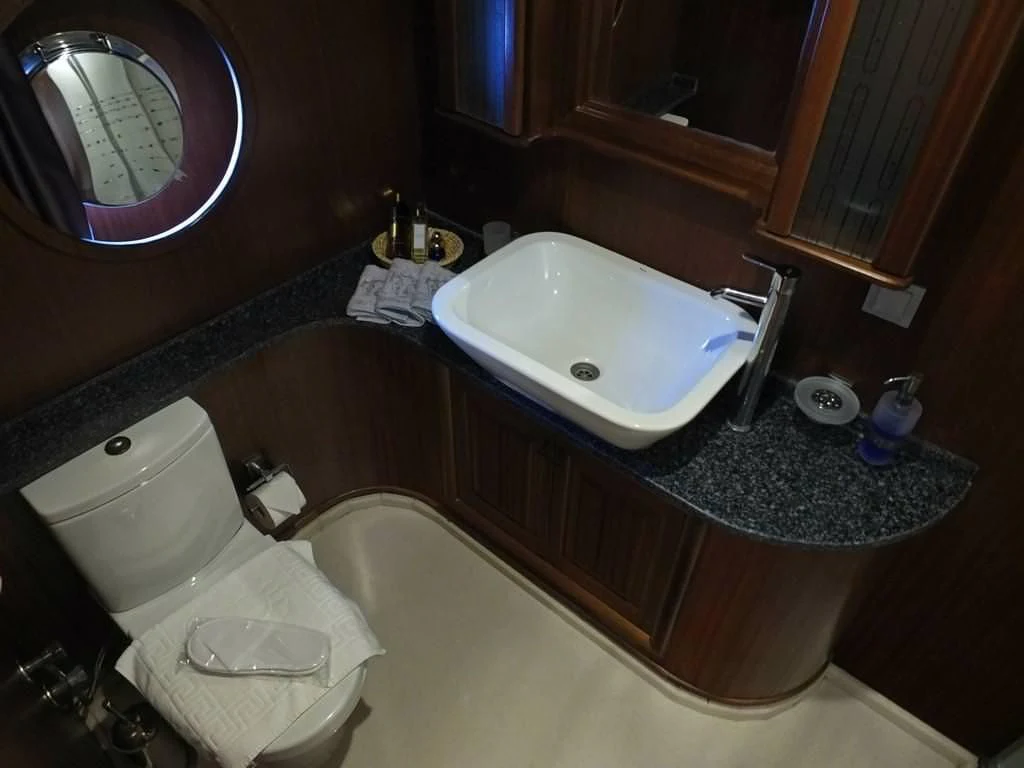 a bathroom with a tub sink and toilet aboard KAPTAN MEHMET BUGRA Yacht for Sale