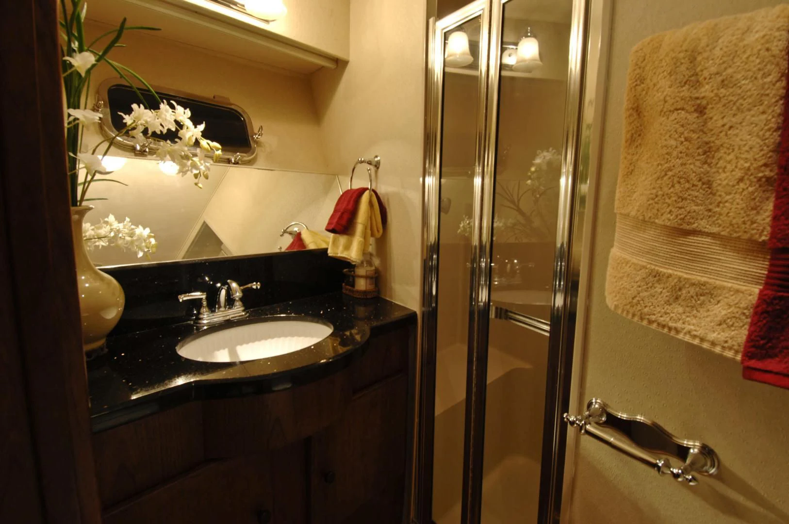 a bathroom with a sink and shower aboard MOONSHADOW Yacht for Sale
