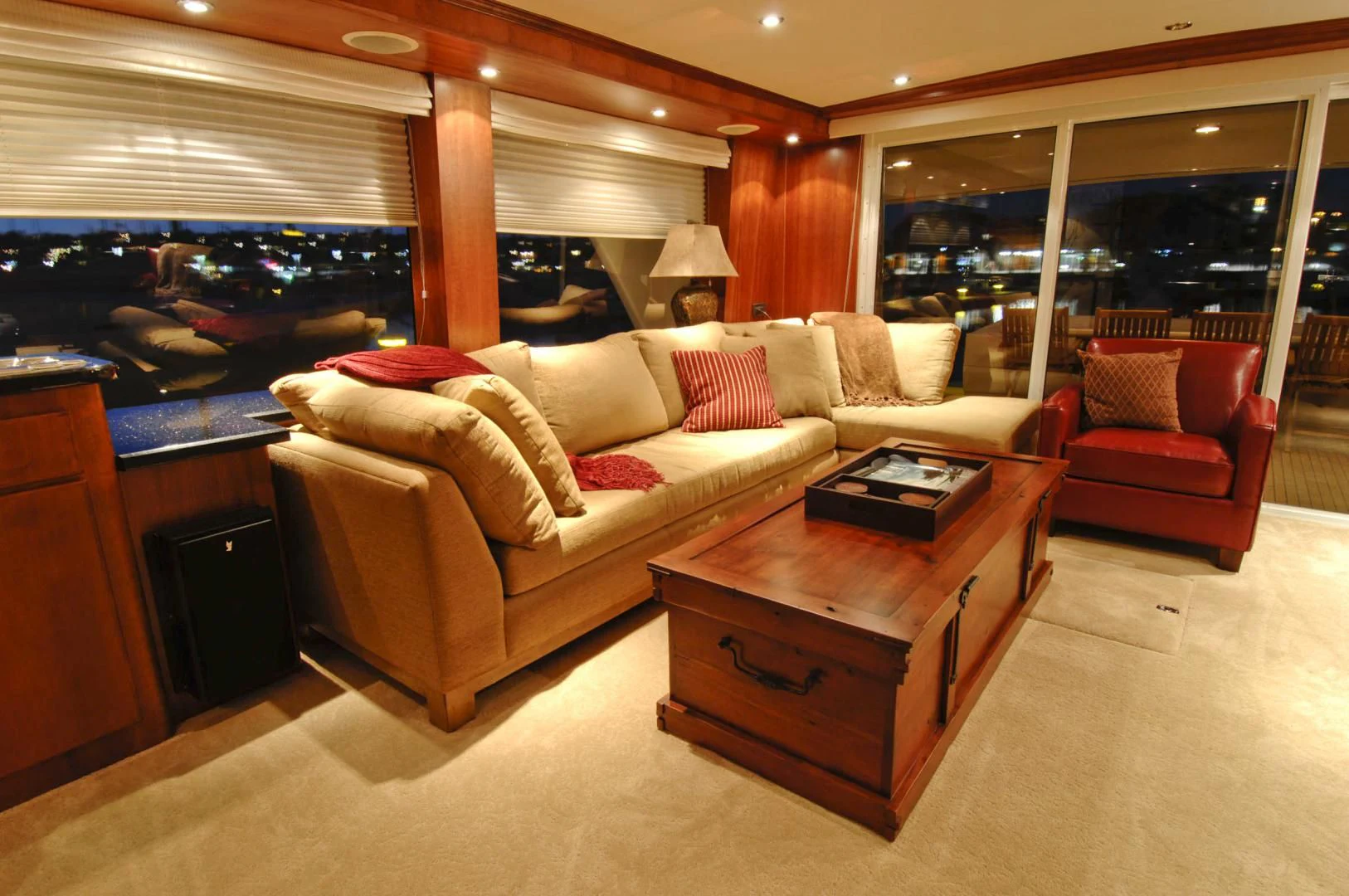 a living room with a large window aboard MOONSHADOW Yacht for Sale