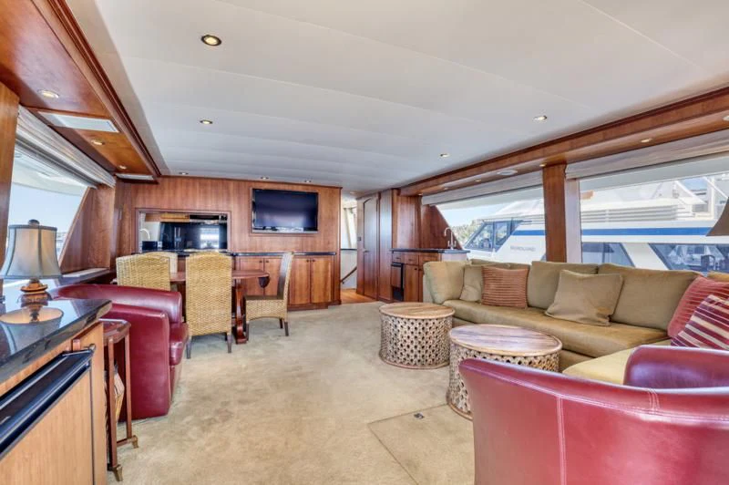 a living room with a couch and a table aboard MOONSHADOW Yacht for Sale