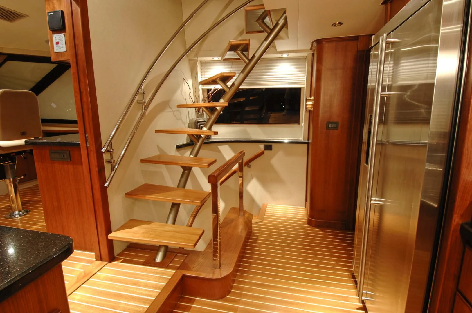 a wooden staircase in a room aboard MOONSHADOW Yacht for Sale