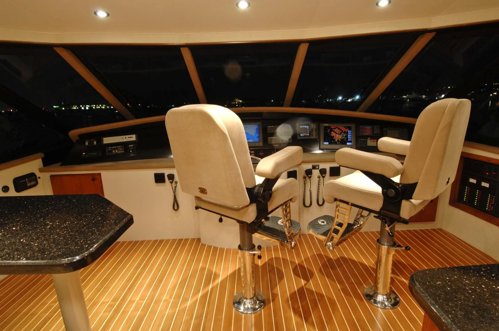 a room with chairs and a table aboard MOONSHADOW Yacht for Sale