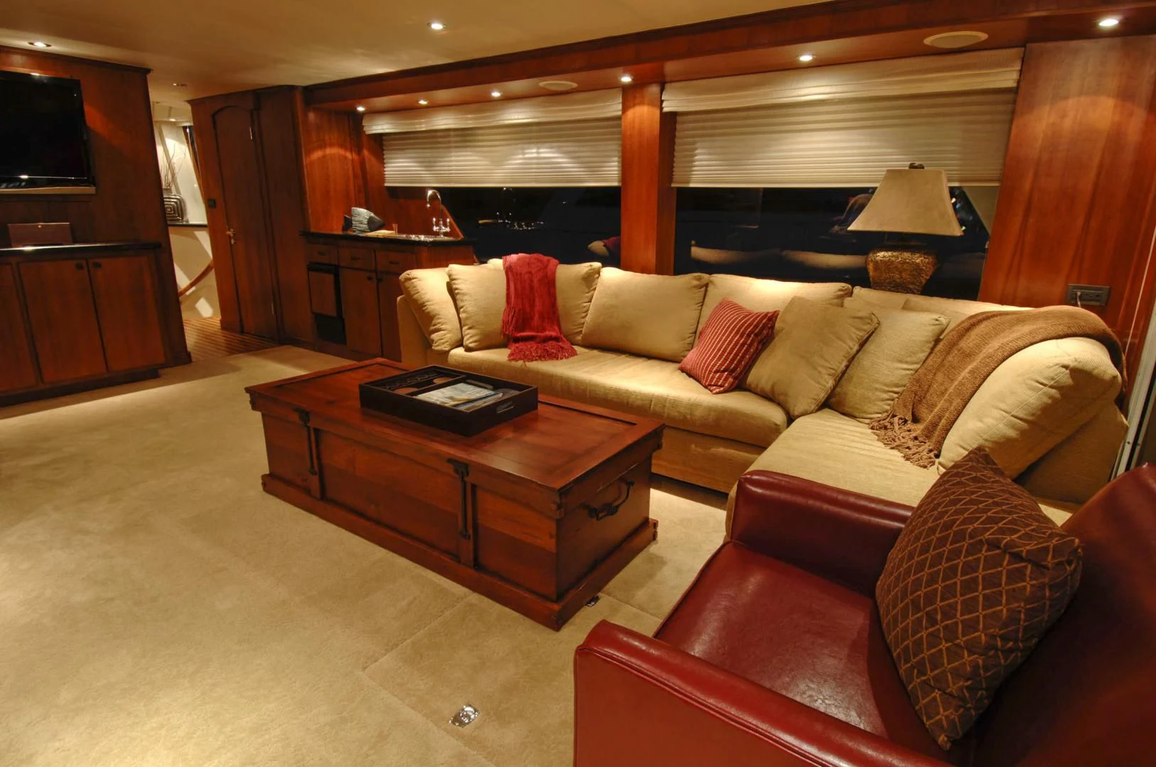 a living room with a couch and a coffee table aboard MOONSHADOW Yacht for Sale