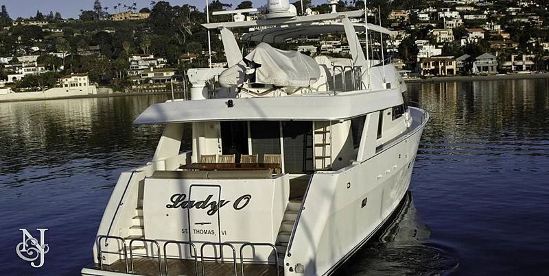a white boat in the water aboard MOONSHADOW Yacht for Sale
