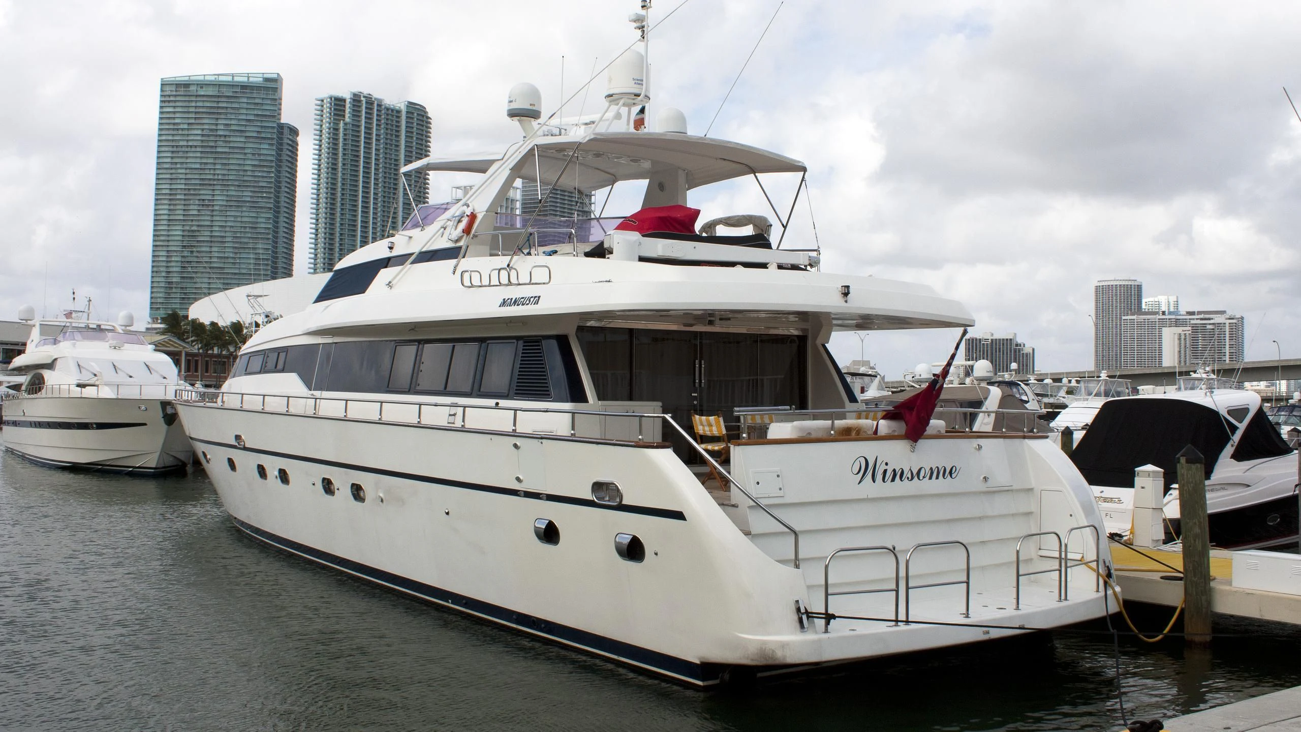 a boat docked at a pier aboard WINSOME Yacht for Sale