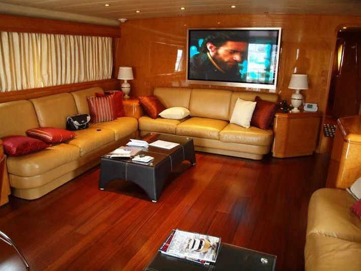 a living room with a large screen aboard WINSOME Yacht for Sale