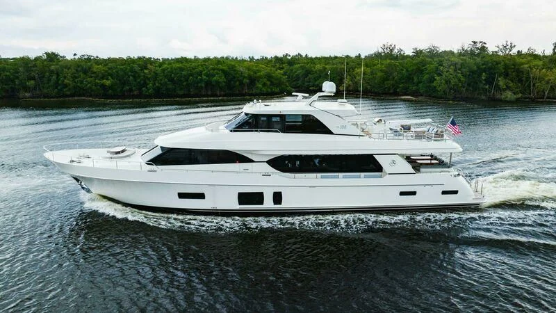 a white yacht on water aboard OA Yacht for Sale