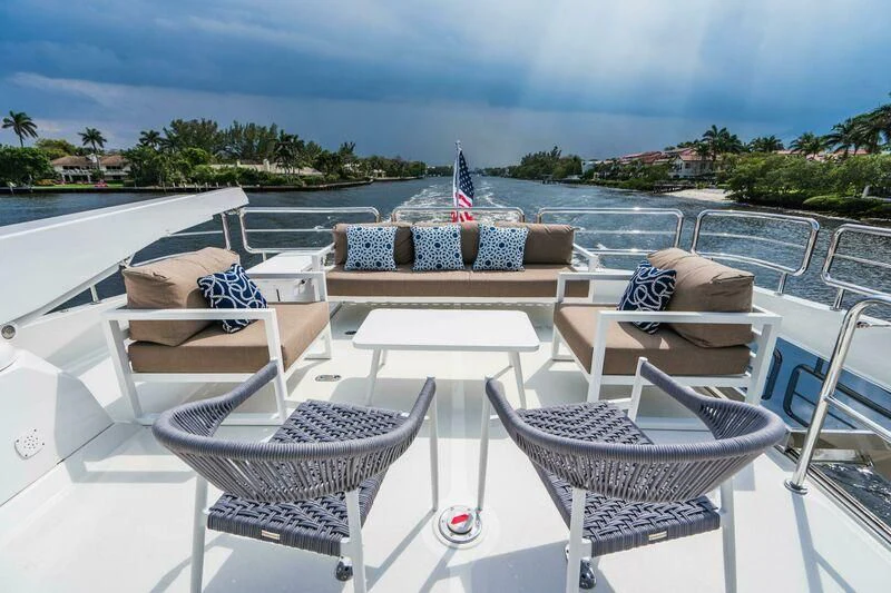 a lounge chair on a deck aboard OA Yacht for Sale