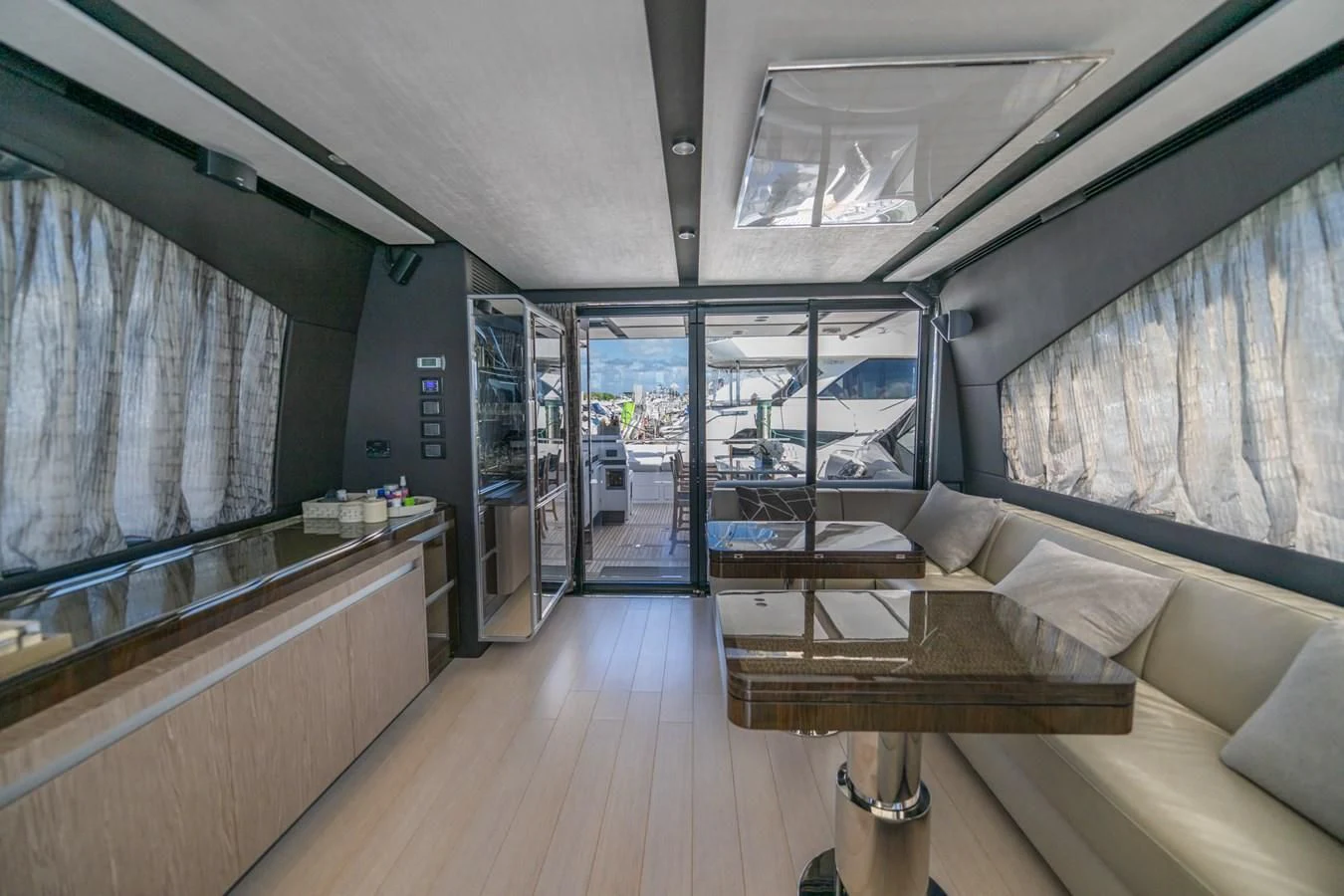 a room with a wood floor and a large window aboard CANDELARIA Yacht for Sale