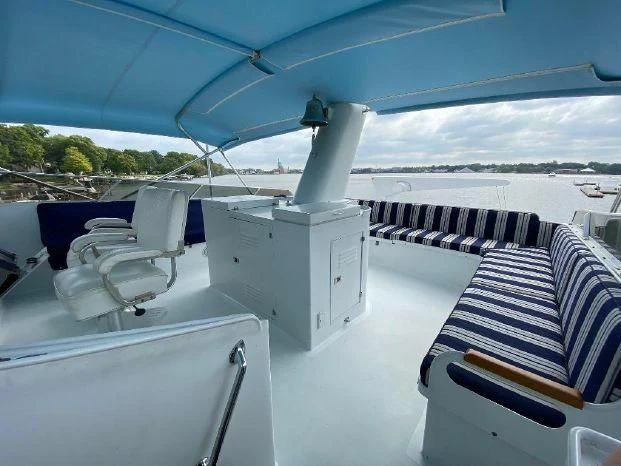 a deck with chairs and a boat aboard YACHTS A LUCK Yacht for Sale