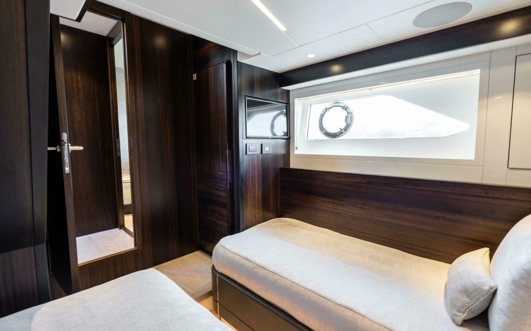 a room with a bed and a television aboard 4-PLAY VII Yacht for Sale