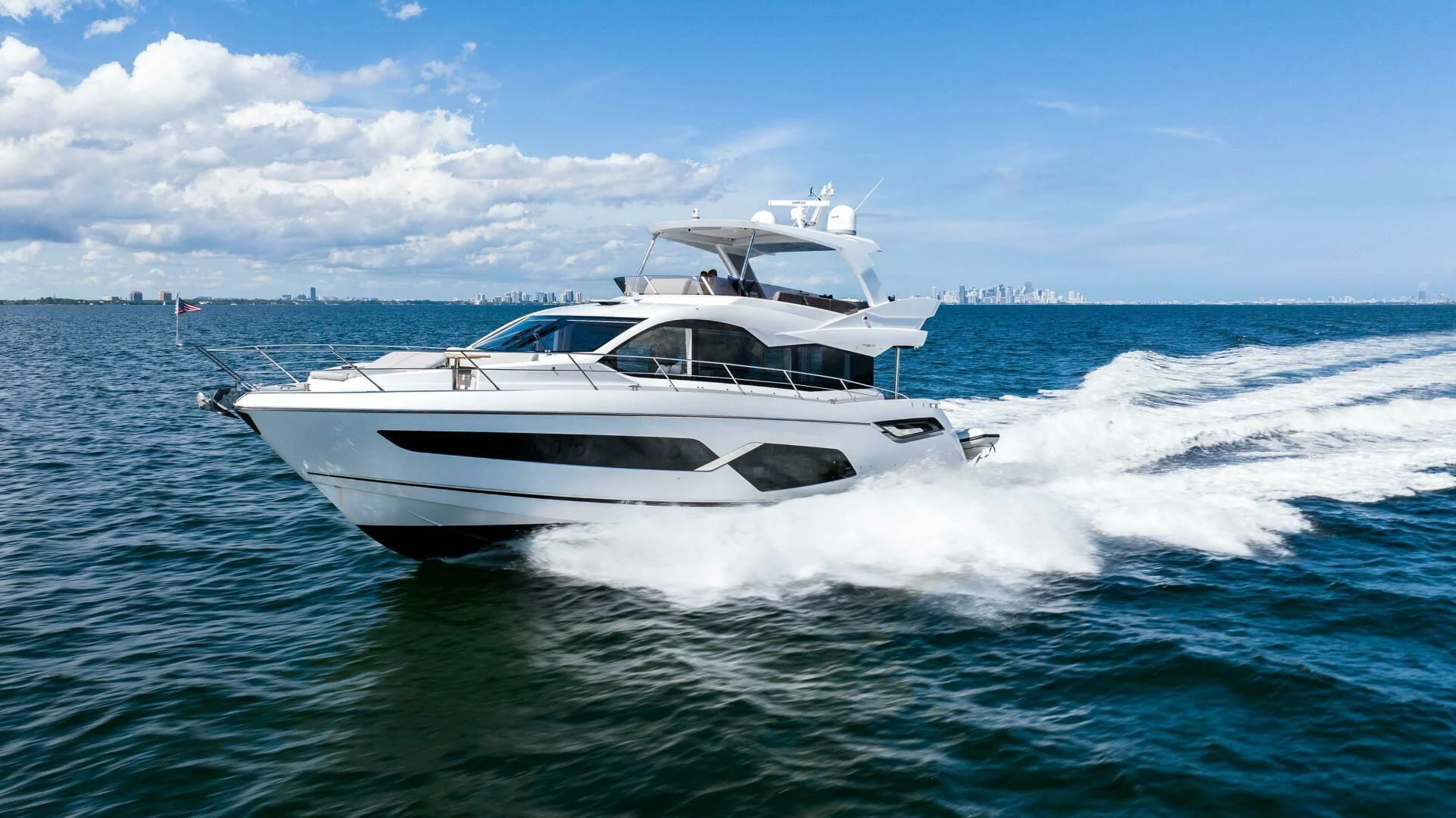 a white yacht on the water aboard 4-PLAY VII Yacht for Sale