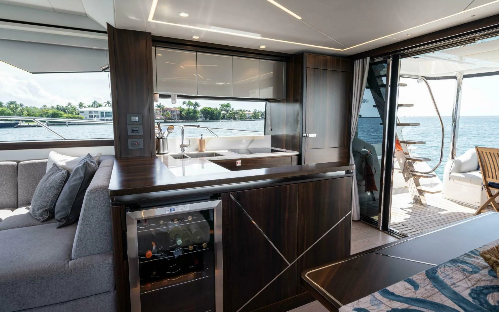 a living room with a fireplace aboard 4-PLAY VII Yacht for Sale