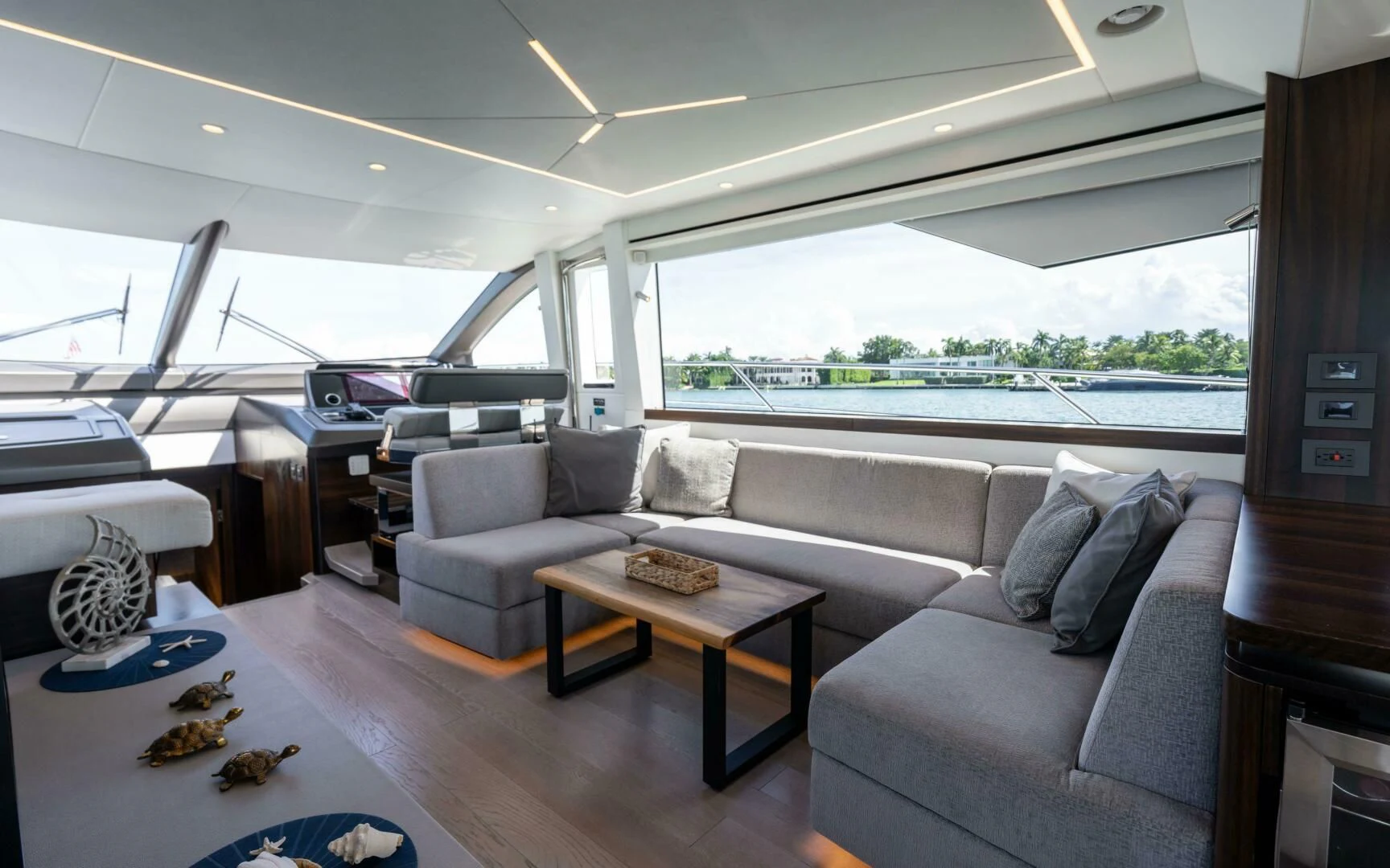 a living room with a couch and a table aboard 4-PLAY VII Yacht for Sale
