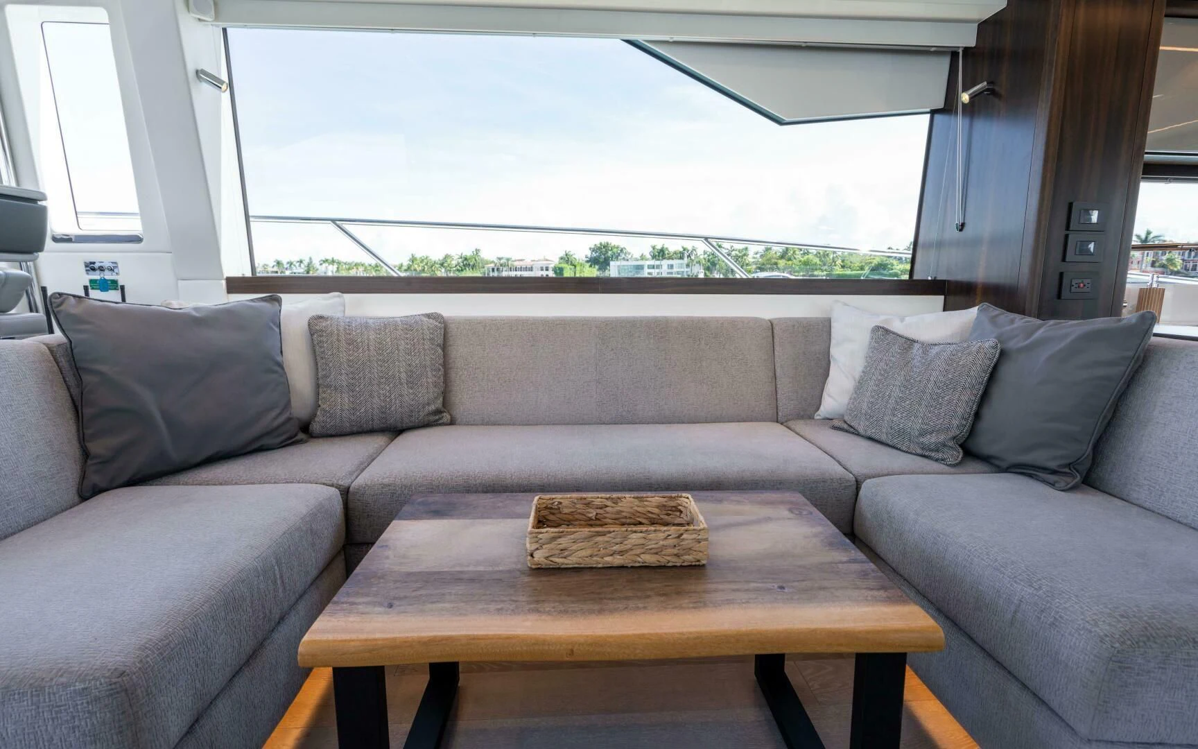 a couch and a table in a room aboard 4-PLAY VII Yacht for Sale