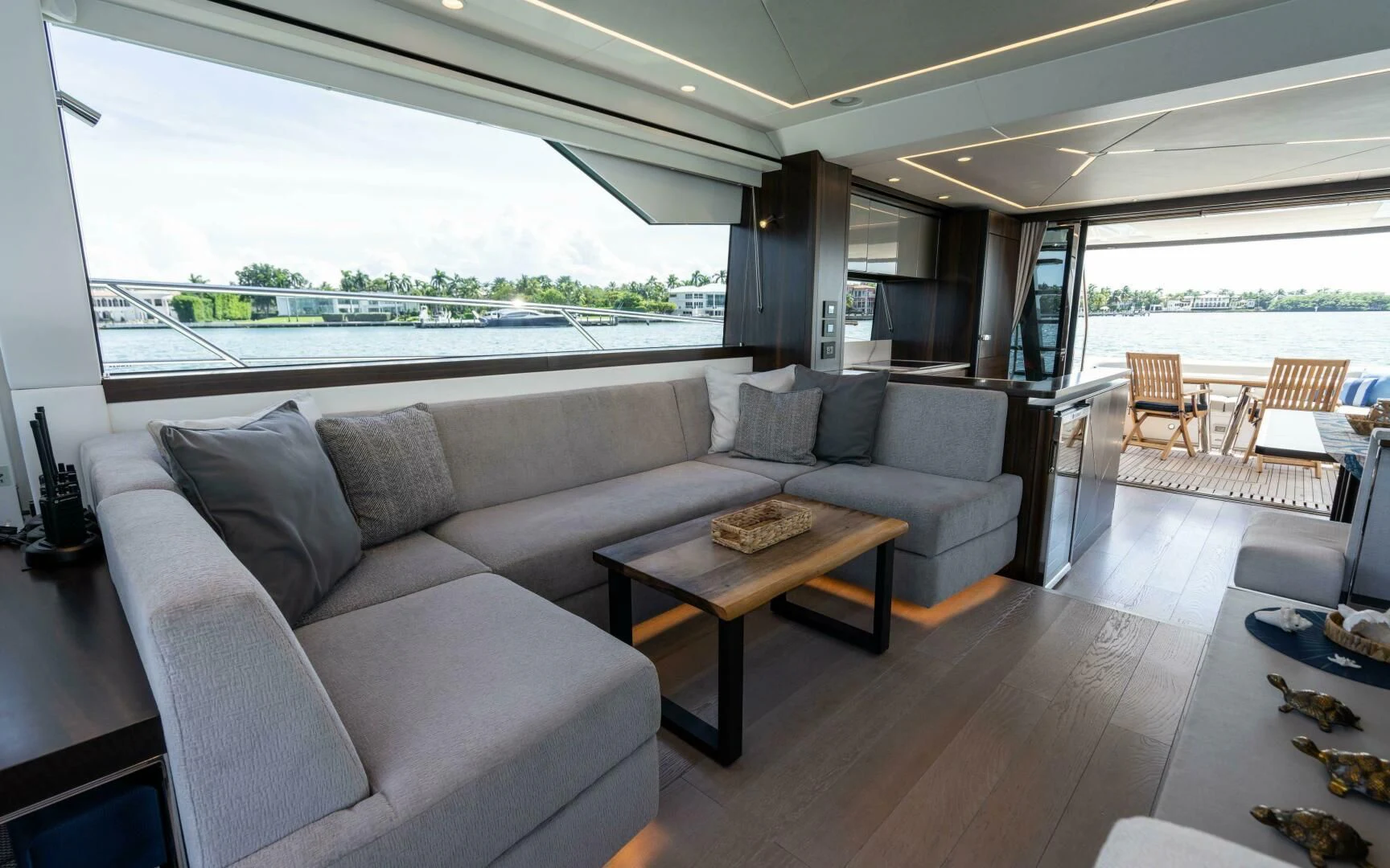a living room with a couch and a table aboard 4-PLAY VII Yacht for Sale