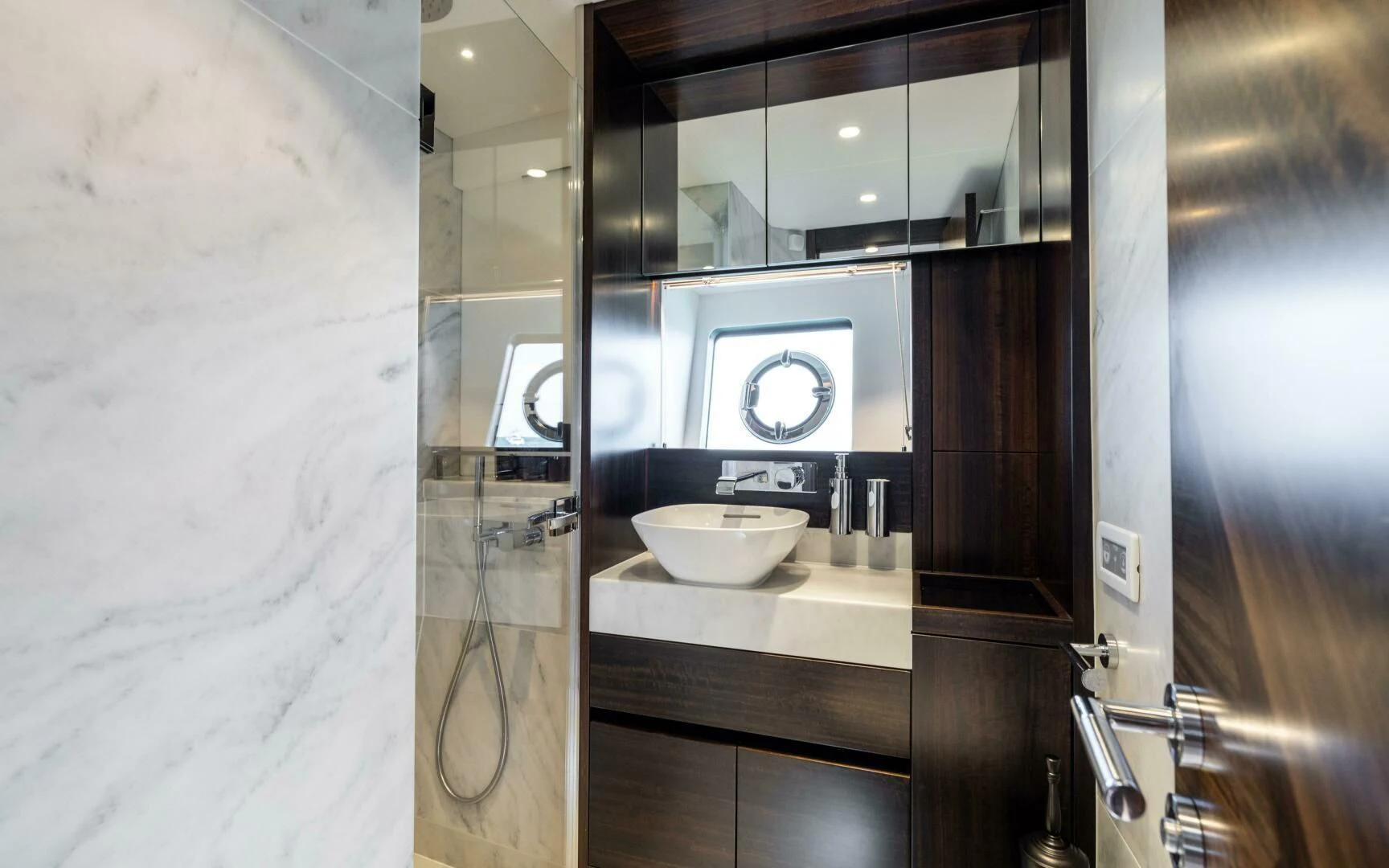 a bathroom with a sink and mirror aboard 4-PLAY VII Yacht for Sale