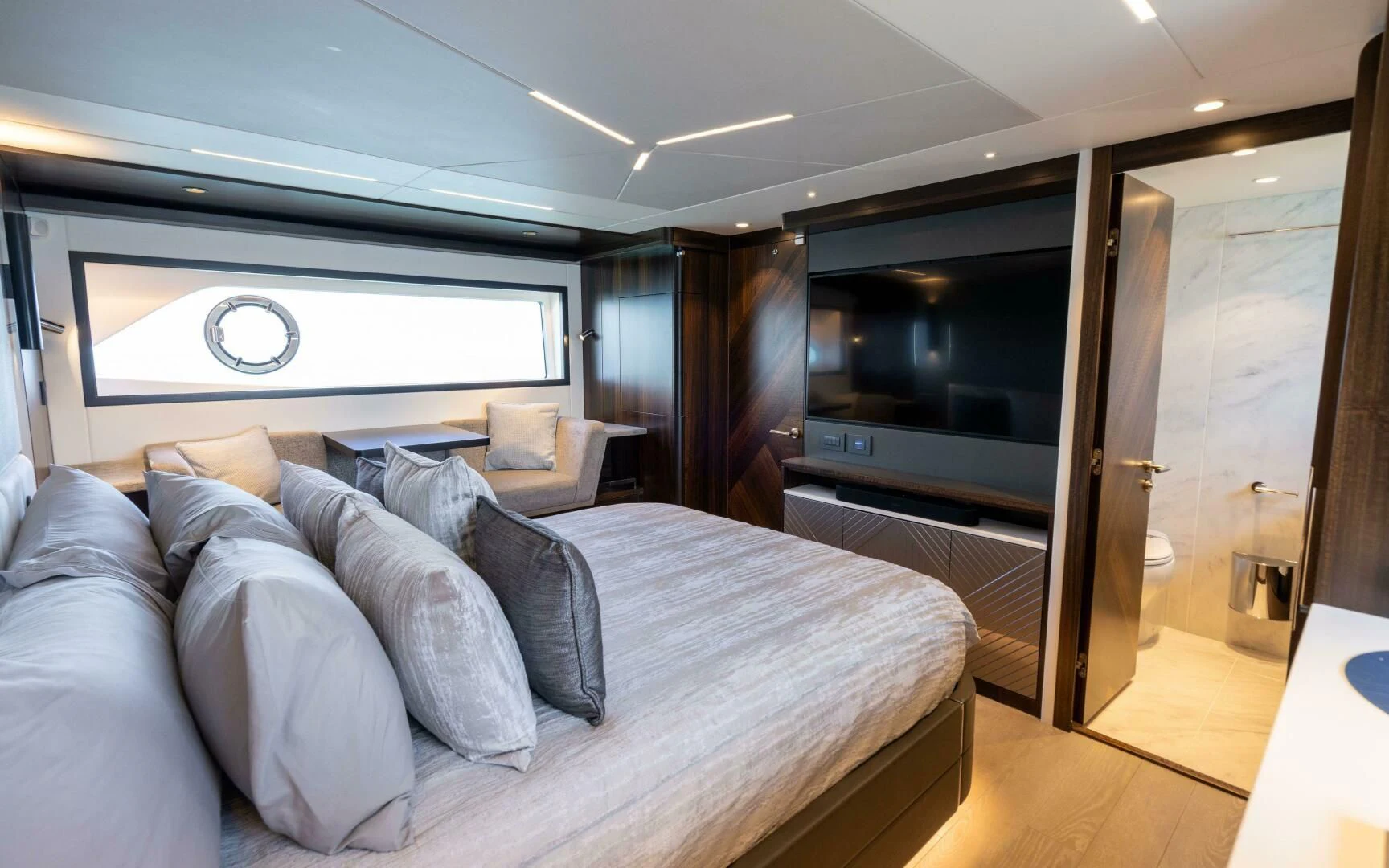 a living room with a couch and a tv aboard 4-PLAY VII Yacht for Sale