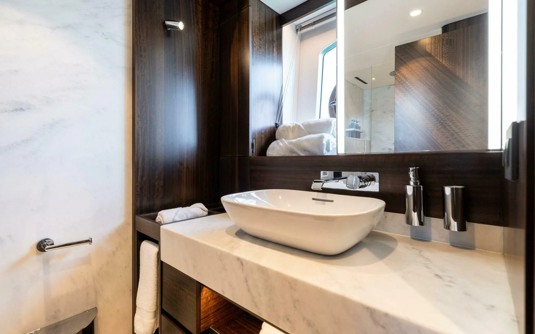 a bathroom with a sink and mirror aboard 4-PLAY VII Yacht for Sale