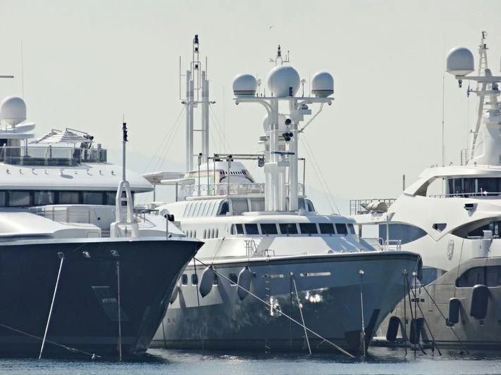 several boats are parked in a harbor aboard CEDAR SEA II Yacht for Sale