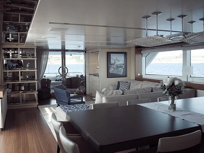 a large living room with a large window aboard THIRTY EIGHT Yacht for Sale