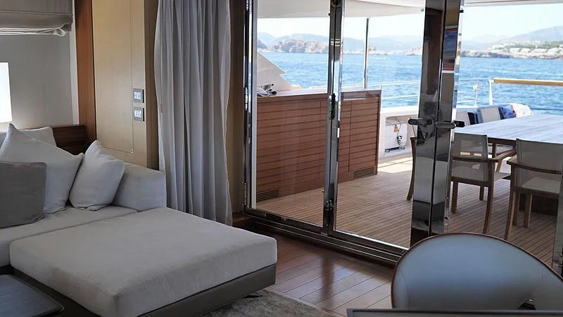 a room with a bed and a table and chairs aboard THIRTY EIGHT Yacht for Sale