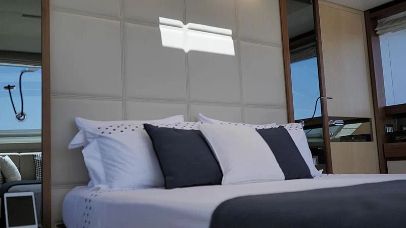 a bed with white sheets aboard THIRTY EIGHT Yacht for Sale