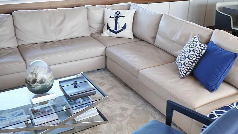 a living room with a white couch aboard THIRTY EIGHT Yacht for Sale