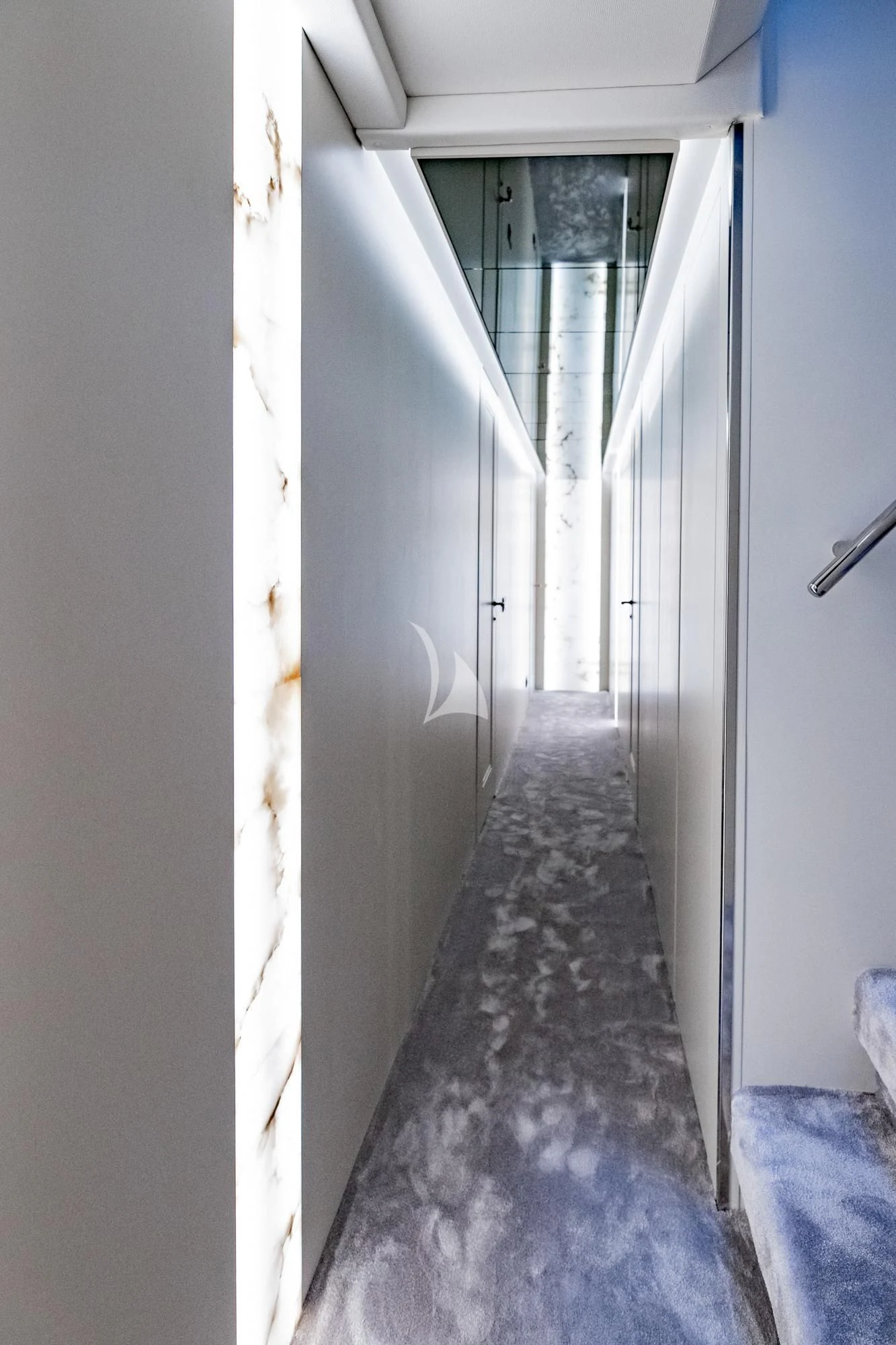 a hallway with white walls aboard EVA Yacht for Charter
