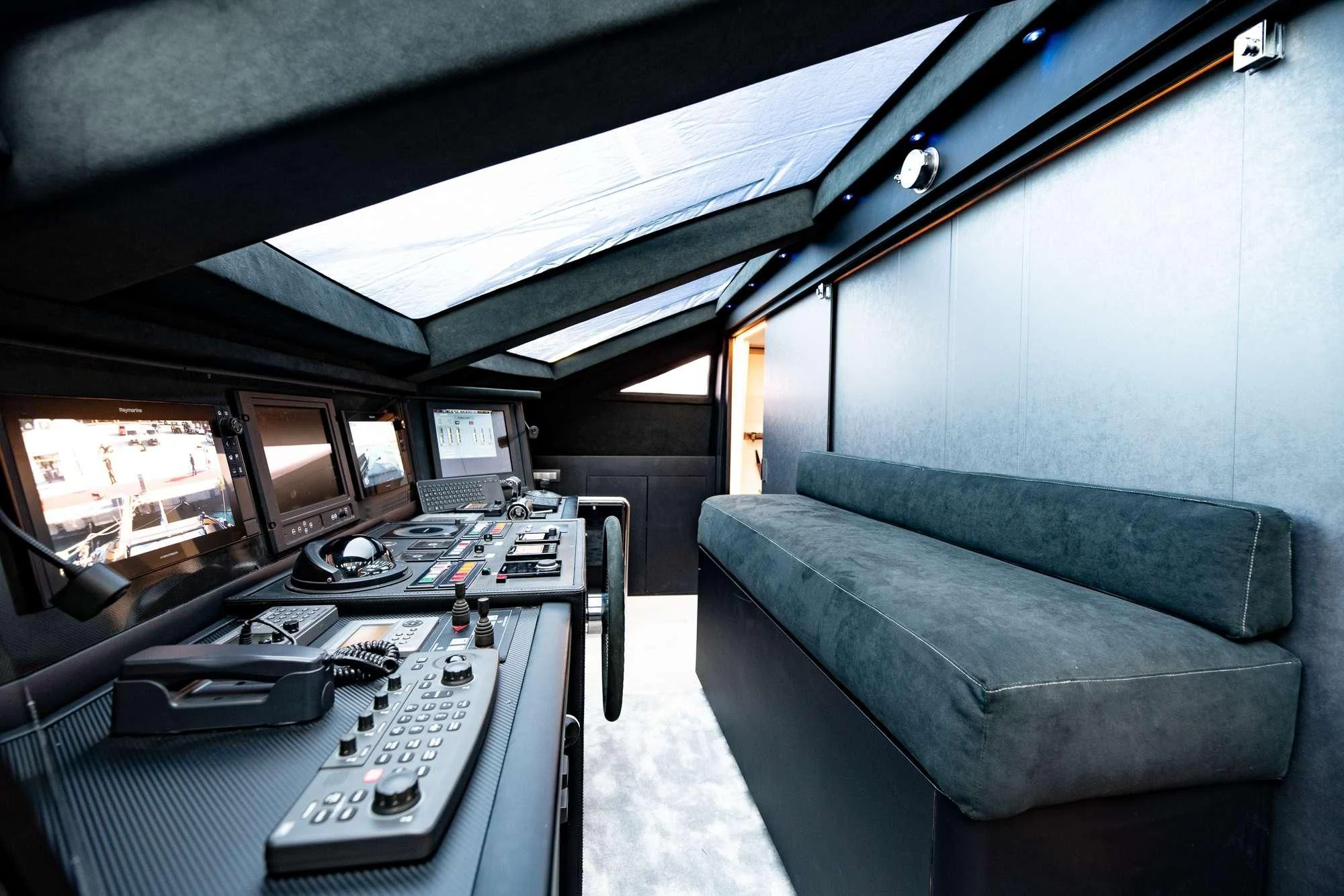 a vehicle with a keyboard and monitors aboard EVA Yacht for Charter