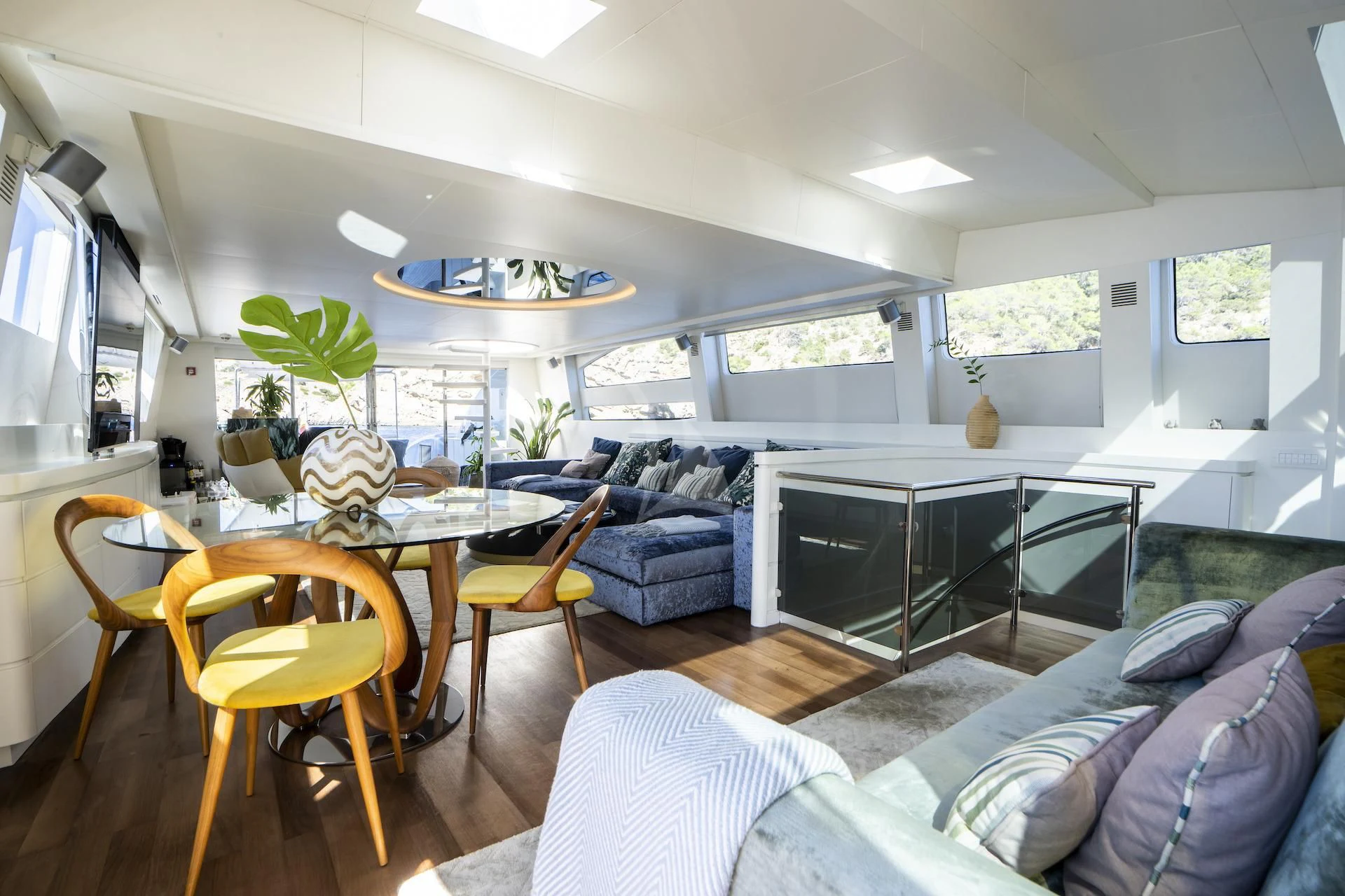 a living room with a couch and a table aboard EVA Yacht for Charter