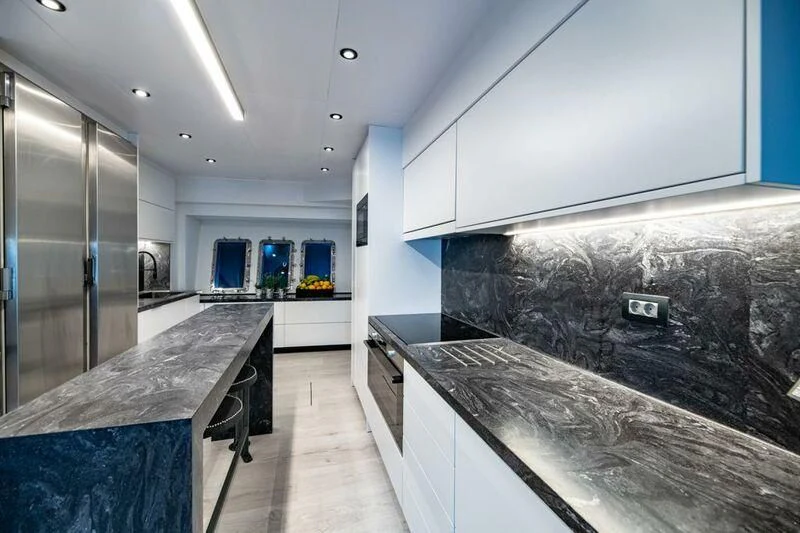 a kitchen with marble counter tops aboard EVA Yacht for Charter