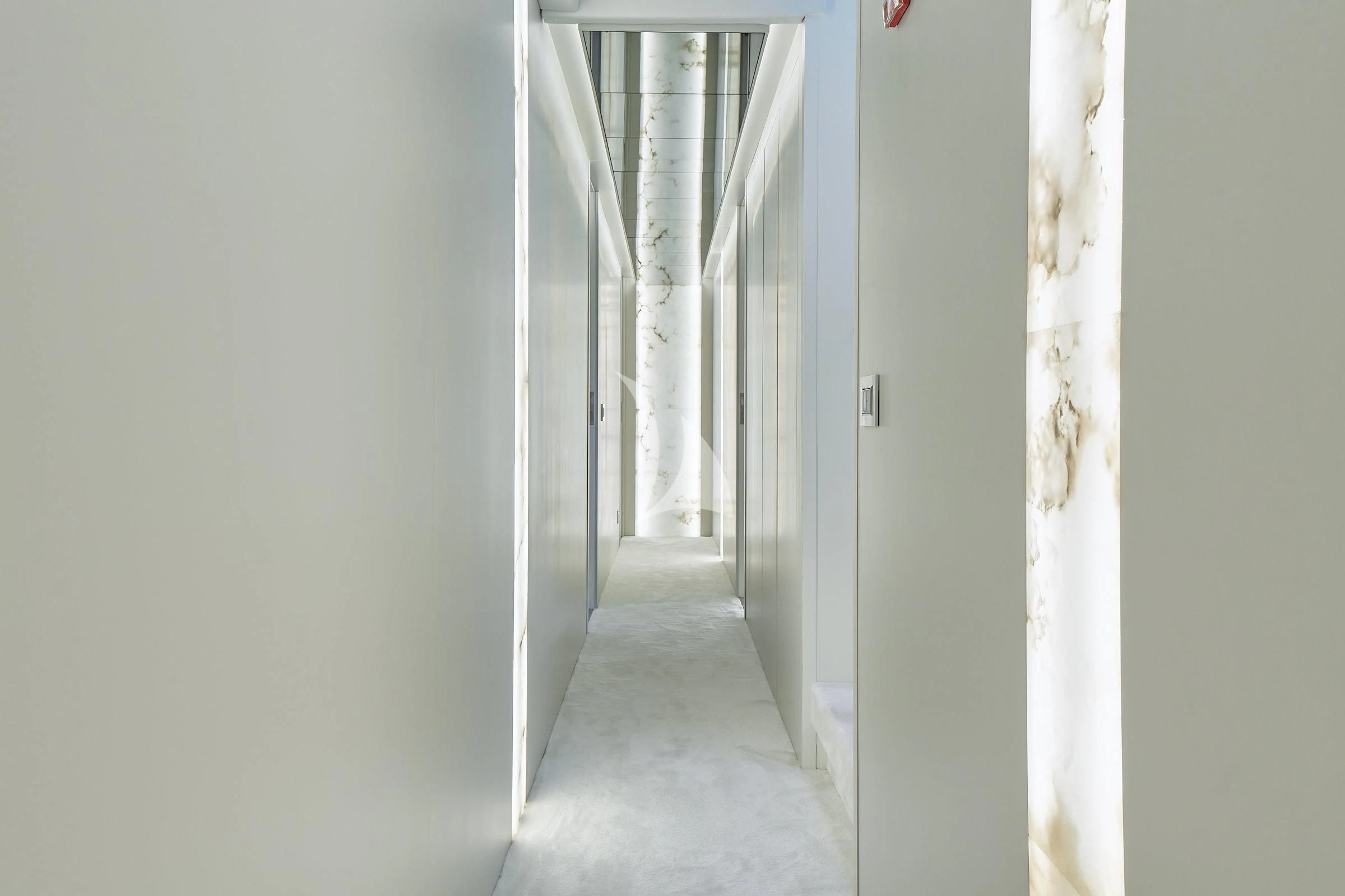 a hallway with white walls aboard EVA Yacht for Charter