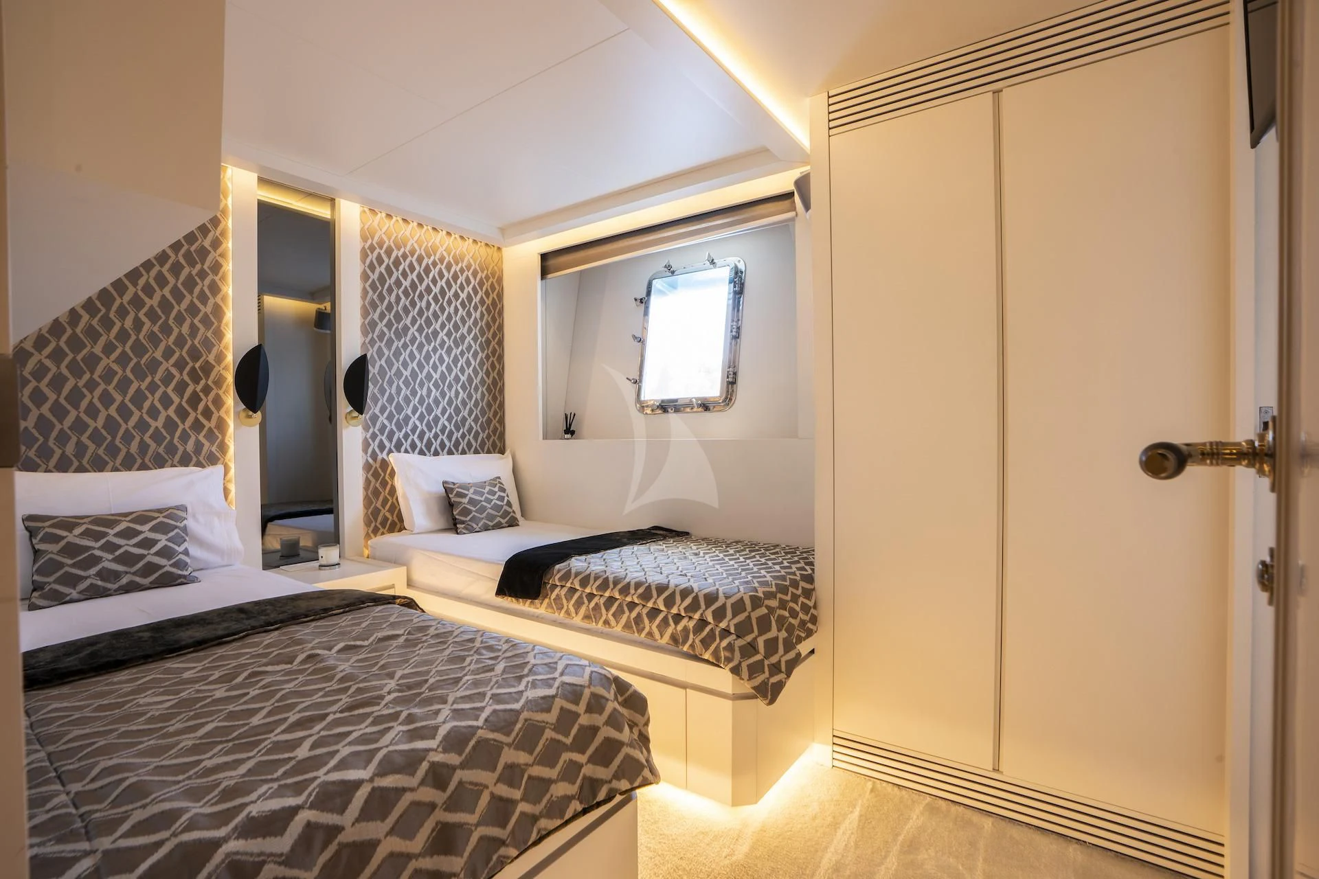 a couple of beds in a hotel room aboard EVA Yacht for Charter