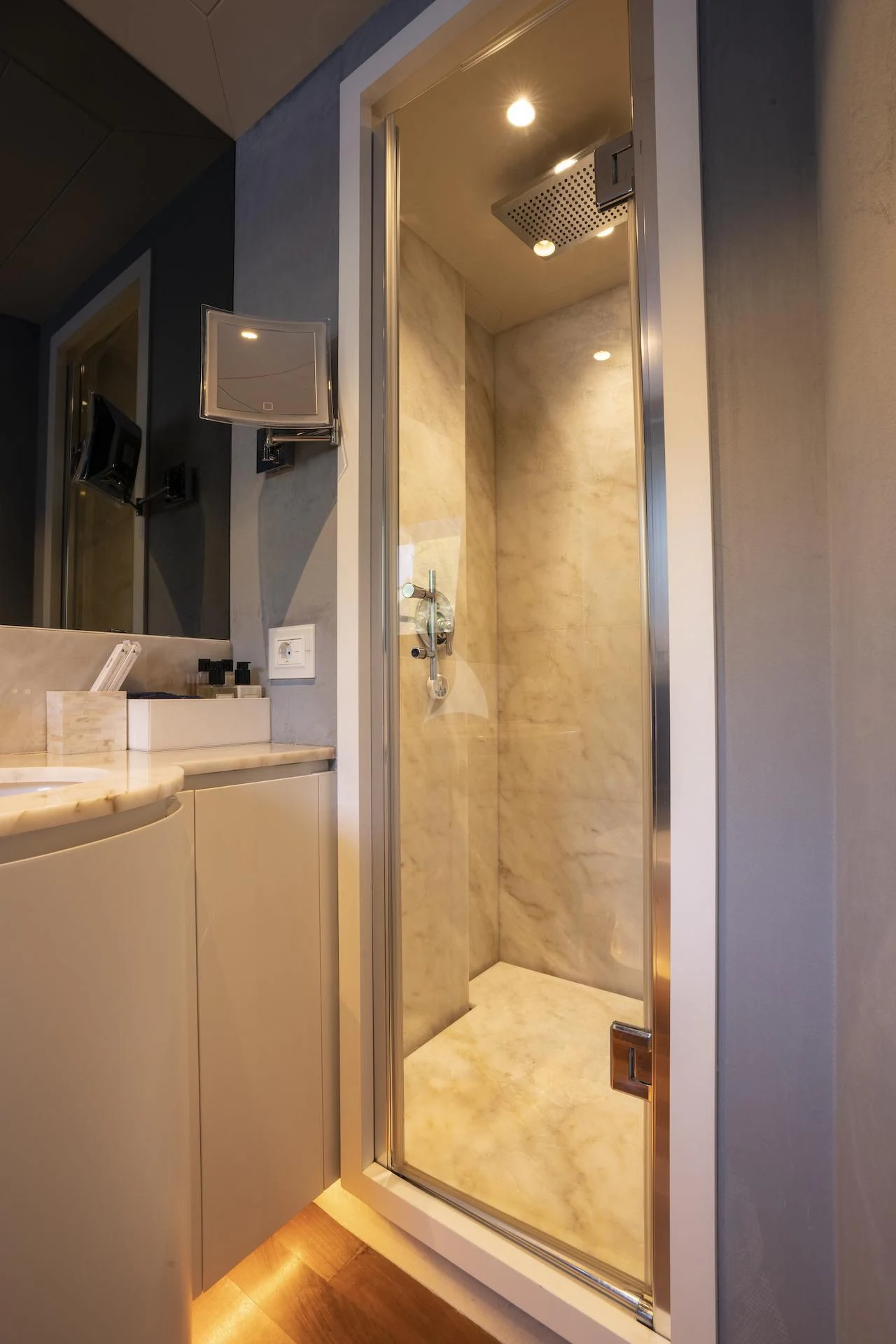 a bathroom with a glass shower aboard EVA Yacht for Charter