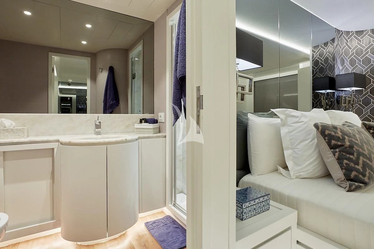 a bathroom with a sink and a mirror aboard EVA Yacht for Charter