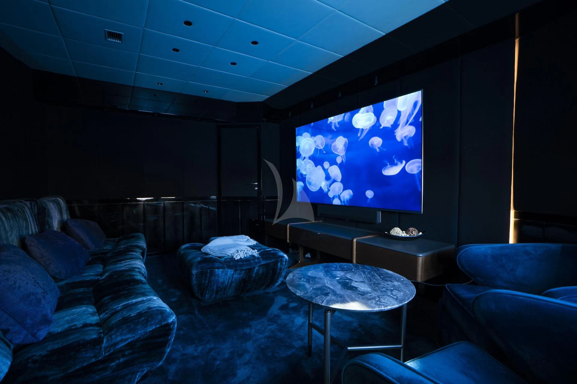 a room with a blue screen aboard EVA Yacht for Charter